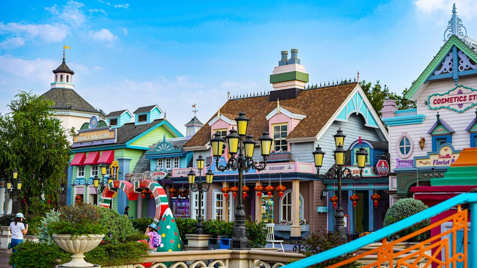 family theme park entrance children smiling colorful