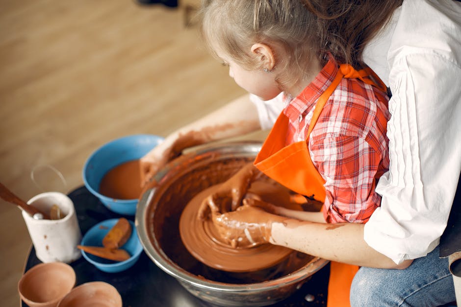 family at traditional cultural workshop, child making pottery or lanterns, hands-on history activity