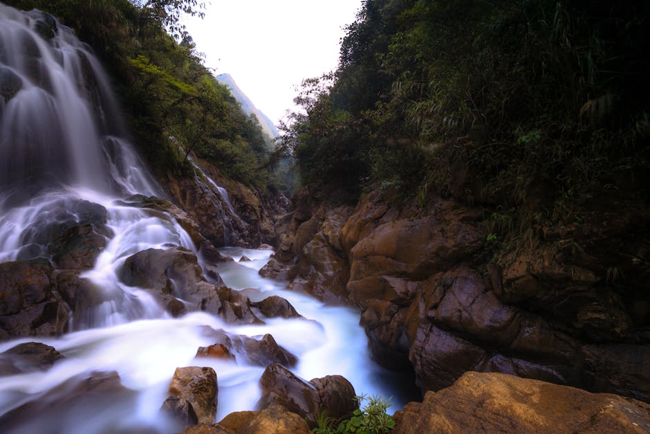 Korea hidden valley waterfall lush green gorge sunlight