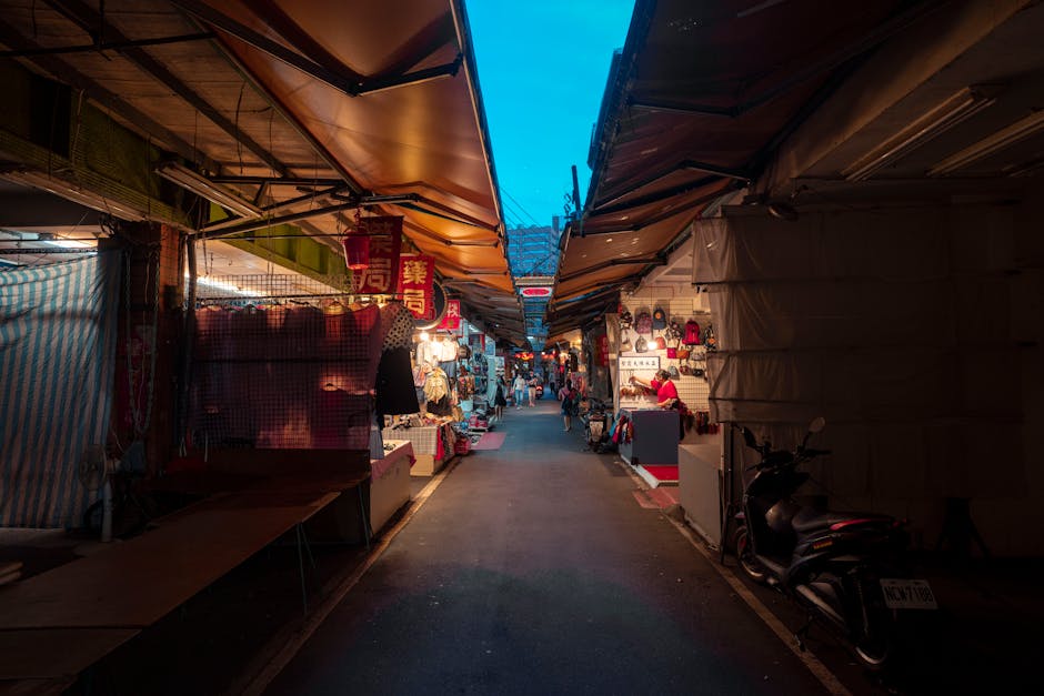 street food alley night market lanterns vendors bustling atmosphere
