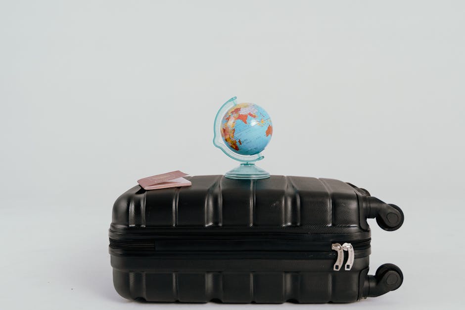 family travel planning, budget vacation, world map with suitcases