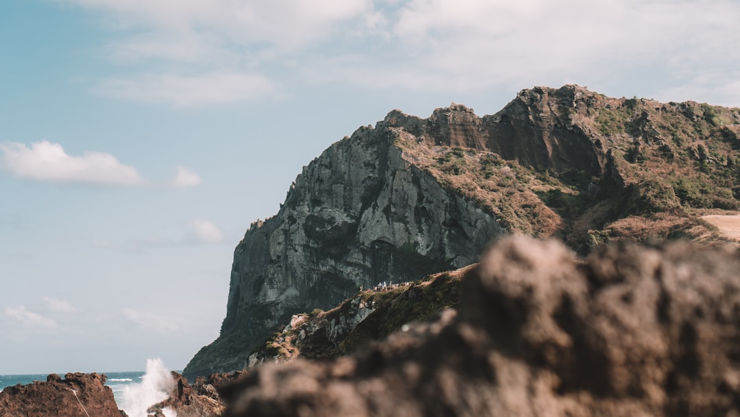 hidden korean coastline, dramatic sea cliffs, secret beach Korea