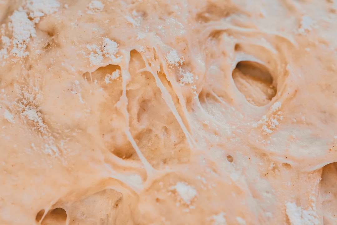 sourdough starter bubbling glass jar, flour water mixture fermentation