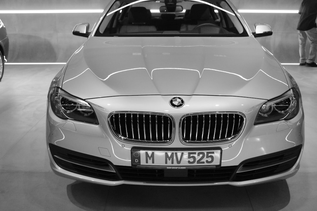 BMW 5 Series 2026 exterior side profile, luxury sedan silver